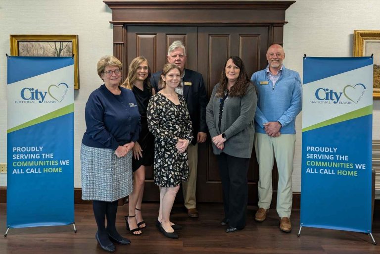 Group of City Cares winners smiling at the camera